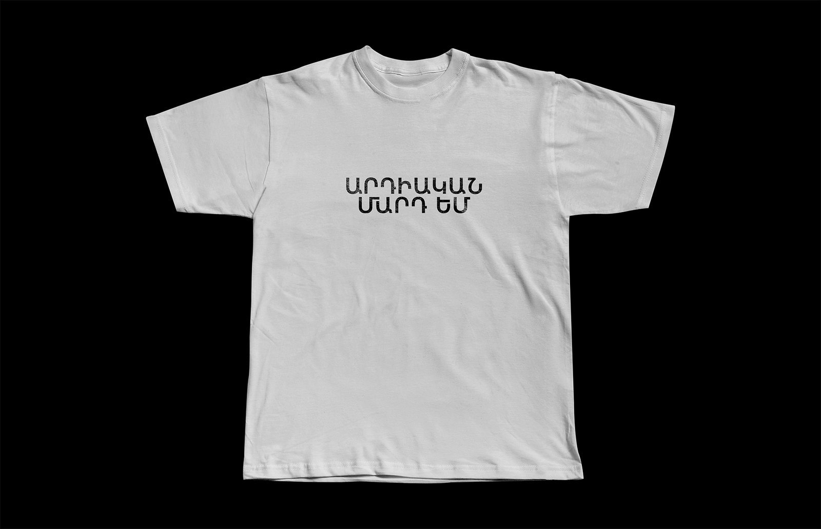 White T-shirt with Armenian text printed in a rounder cut of Ardica.